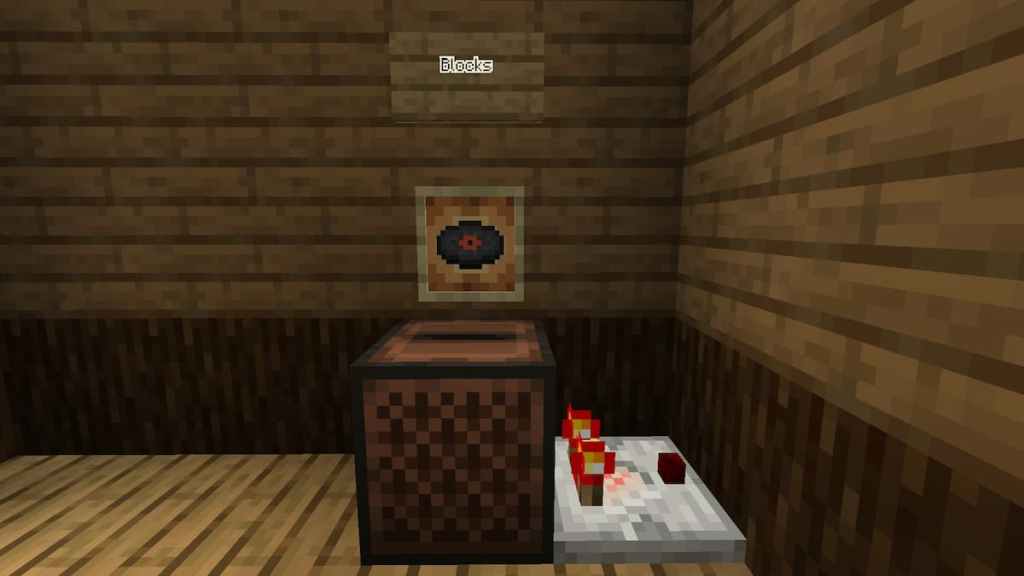 The Blocks Music Disc in Minecraft being used to activate a Redstone Comparator