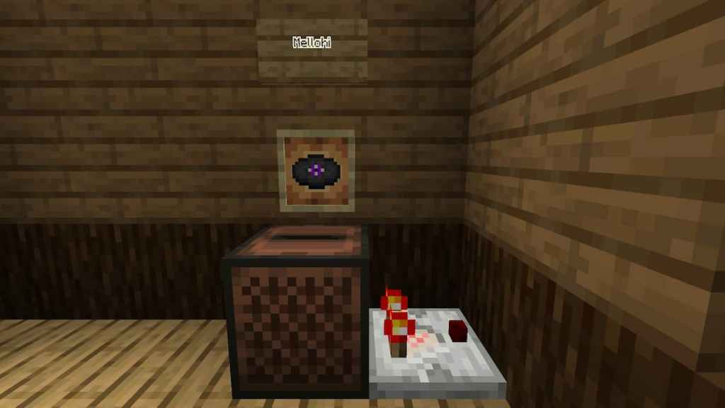 Putting the Mellohi music disk in a jukebox to power a Redstone Comparator