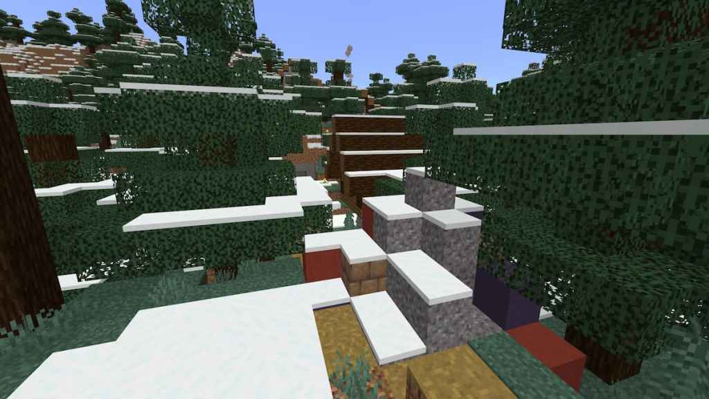 Snow-covered Trail Ruins near a Minecraft village.