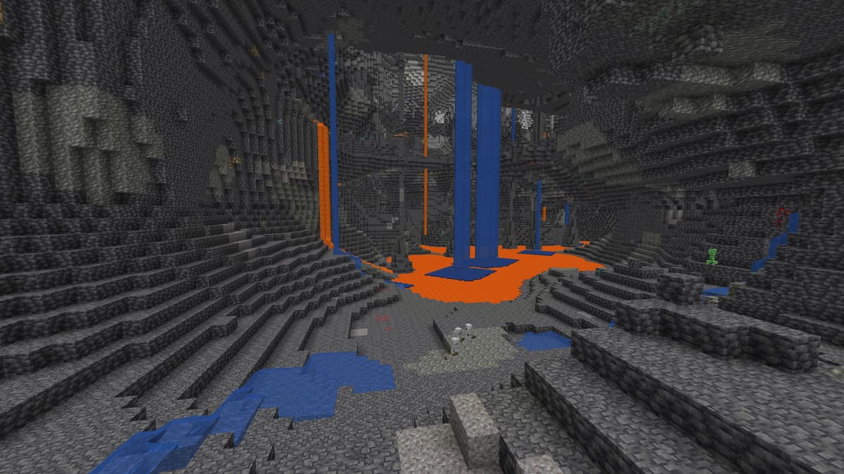 A large deepslate cavern with lava, waterfalls, and diamonds in Minecraft.
