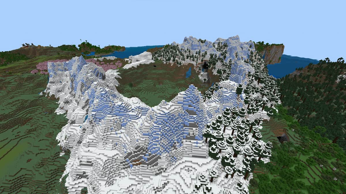 A snowy mountain with a crater filled with grass and trees