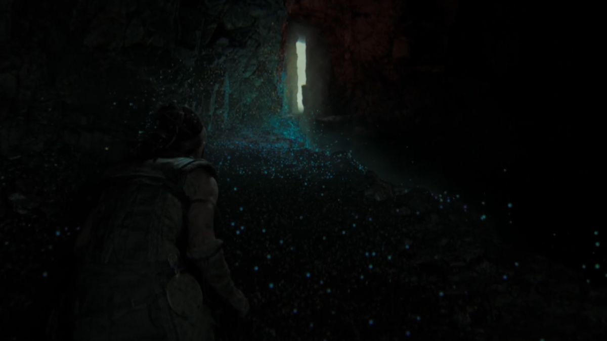 Senua walking towards the light in Hellblade II