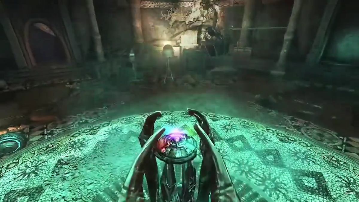 A gem rises from the ground, surrounded by a glowing green circle in the Wolfenstein trailer.