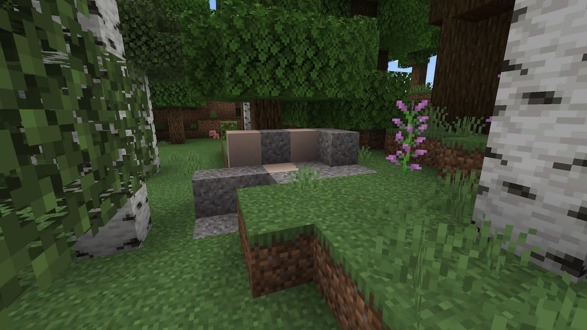 A set of Trail Ruins beneath an oak tree in Minecraft